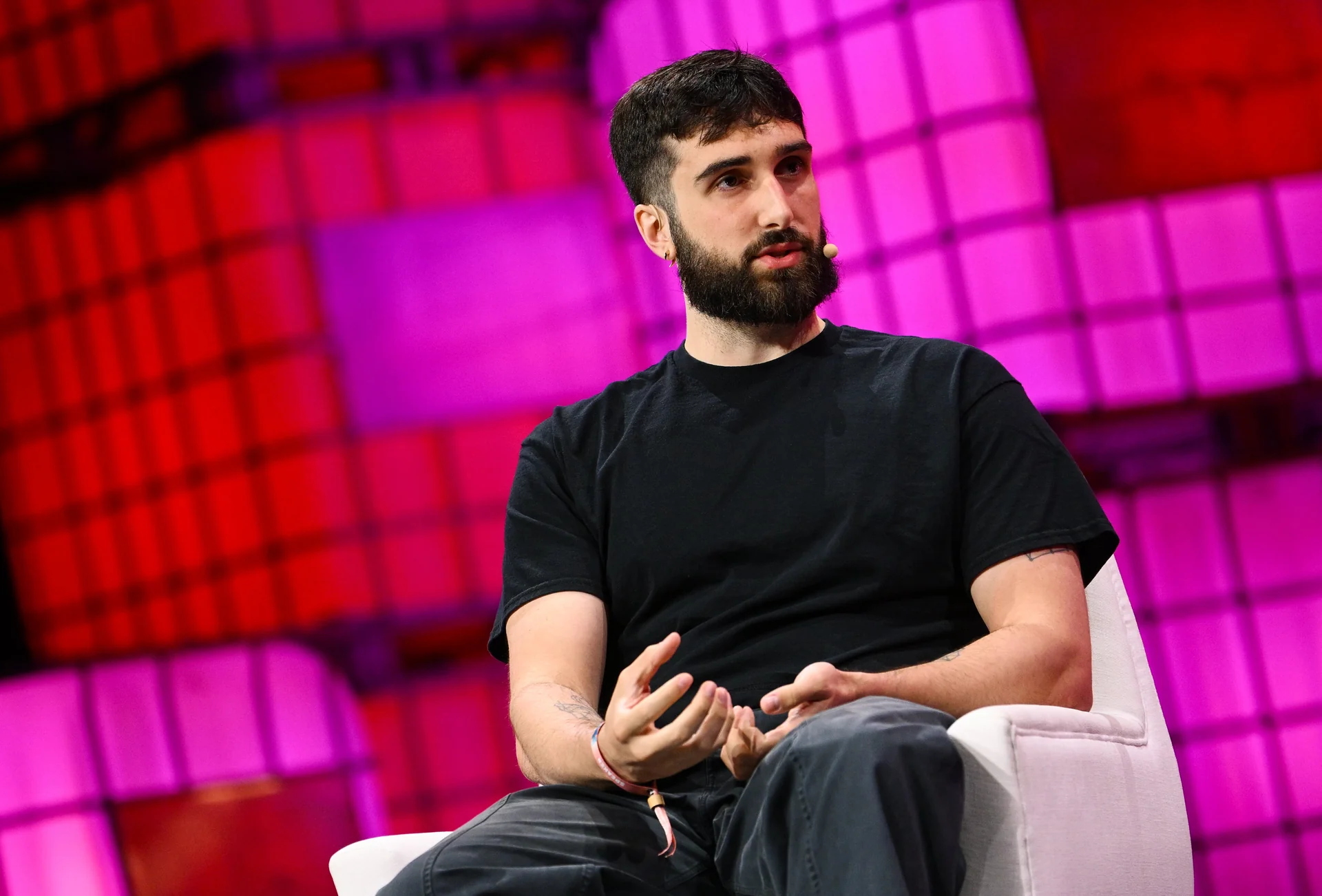 Cohere co-founder Aidan Gomez speaking onstage at Collision 2024.