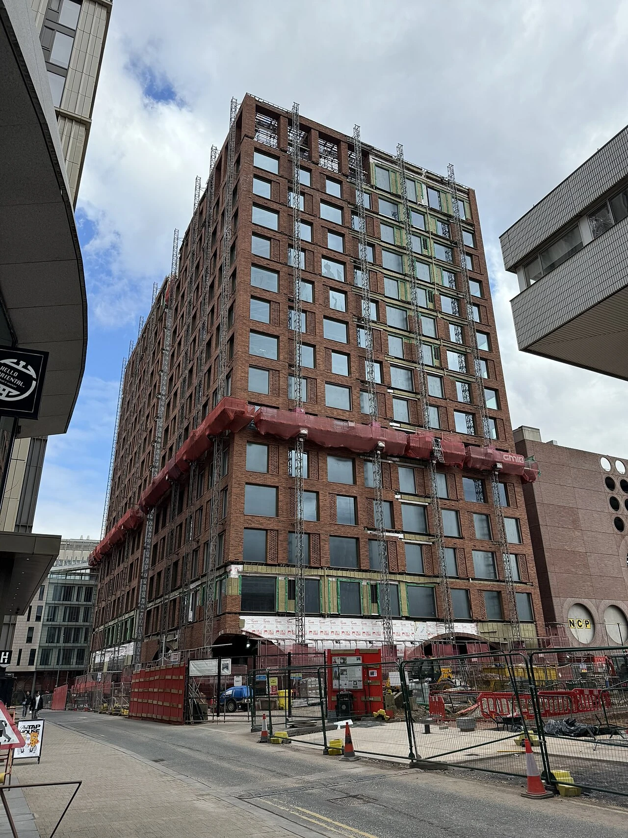 The red facade of No. 3 Circle Square in Manchester as the building neared completion