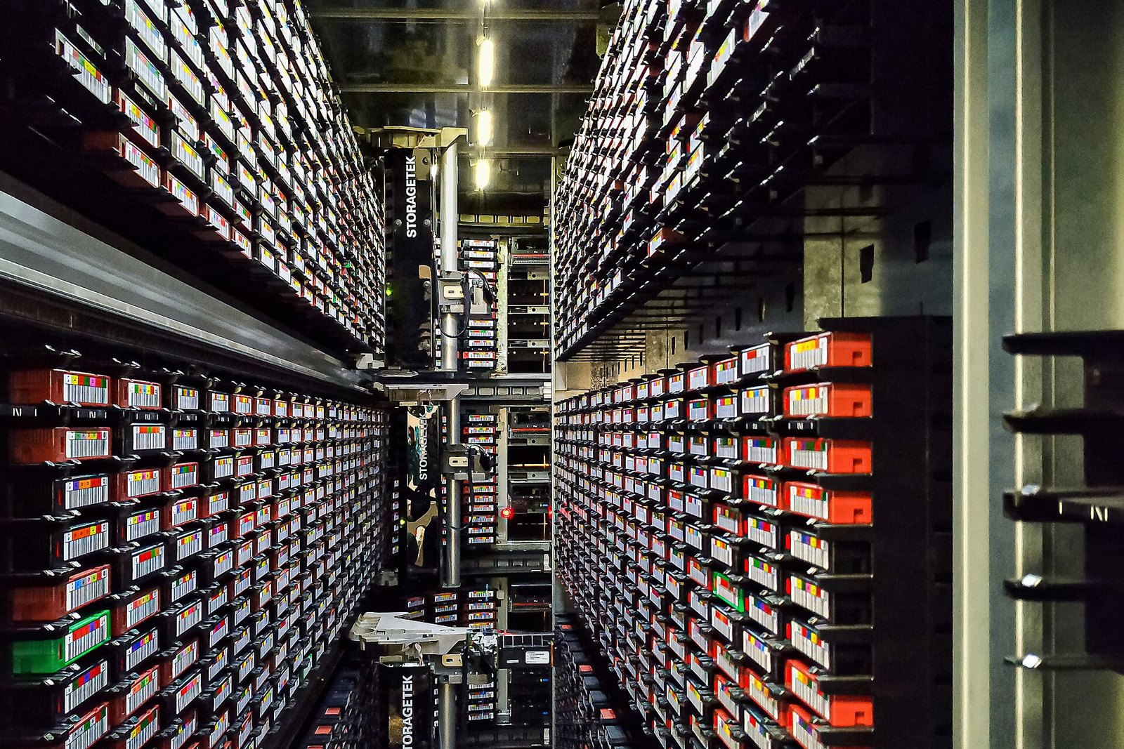 Magnetic tape cartridges and retrieval equipment inside a StorageTek data-protection library