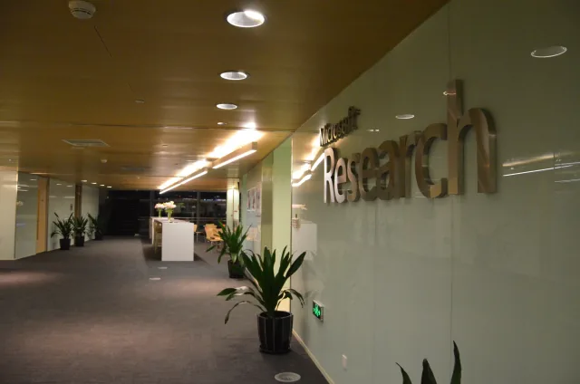 Microsoft Research lettering on a glass wall inside its Beijing office.