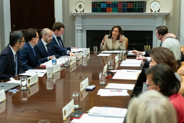 Sam Altman and Dario Amodei sit with other technology executives at a White House meeting led by Kamala Harris.
