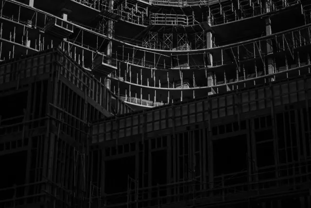 Scaffolding and exposed floors at a construction site in Koreatown, Los Angeles, photographed in black and white.
