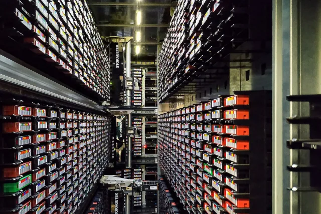 Magnetic tape cartridges and retrieval equipment inside a StorageTek data-protection library